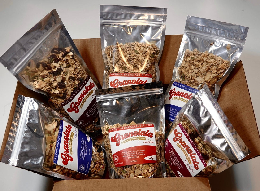 Shipping box filled with six Granolala product